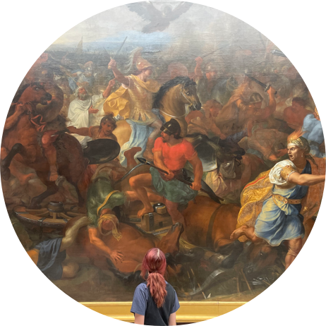 Photo of developer looking at a painting.